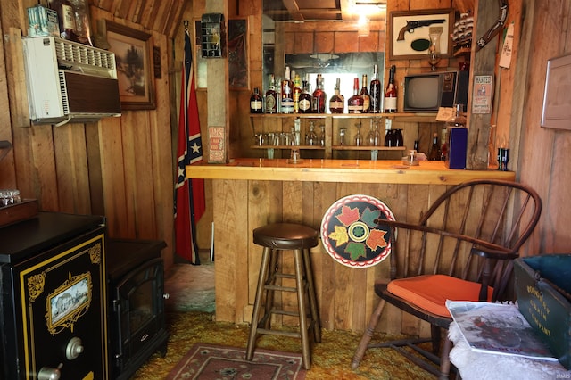 bar with wooden walls and lofted ceiling