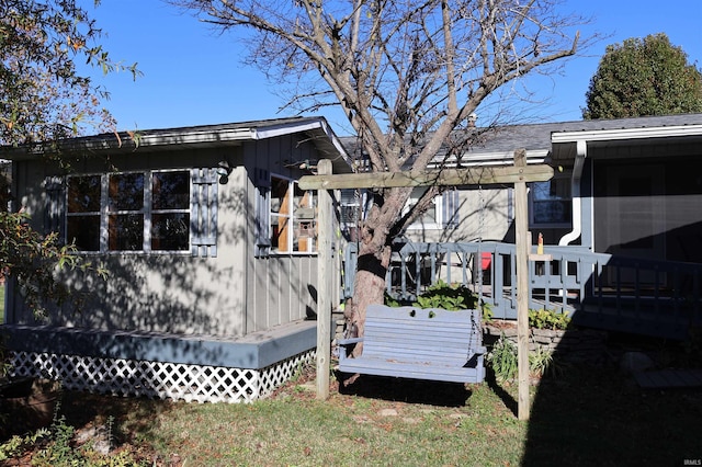208 Sycamore St, Loogootee, IN 47553 - view of side of property with a deck