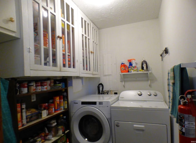 208 Sycamore St, Loogootee, IN 47553 - washroom with cabinet space, washing machine and clothes dryer, and a textured ceiling
