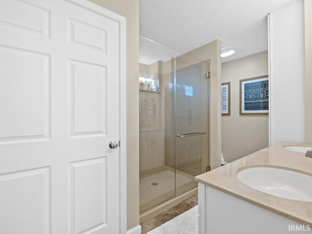 bathroom featuring vanity and walk in shower