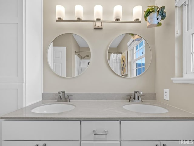 bathroom with vanity and walk in shower