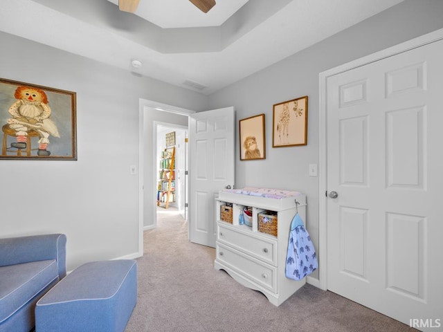 bedroom featuring ceiling fan and light colored carpet