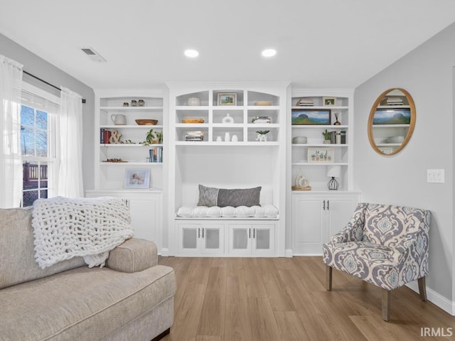 sitting room featuring light hardwood / wood-style flooring