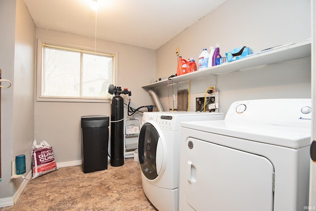 clothes washing area featuring washing machine and clothes dryer