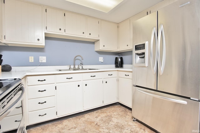 kitchen featuring stainless steel refrigerator with ice dispenser, stove, and sink