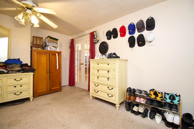 carpeted bedroom featuring ceiling fan and french doors