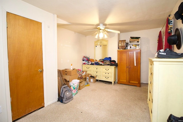 bedroom featuring ceiling fan and light carpet