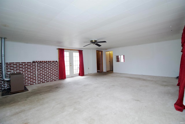 unfurnished room featuring ceiling fan and french doors