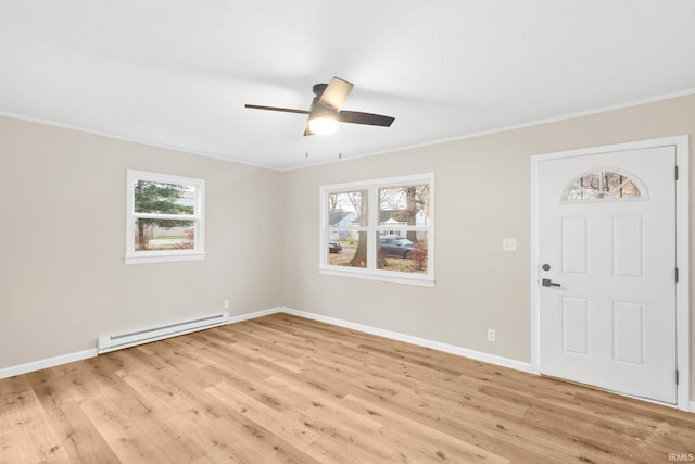 entrance foyer with ceiling fan, light hardwood / wood-style floors, crown molding, and a baseboard radiator