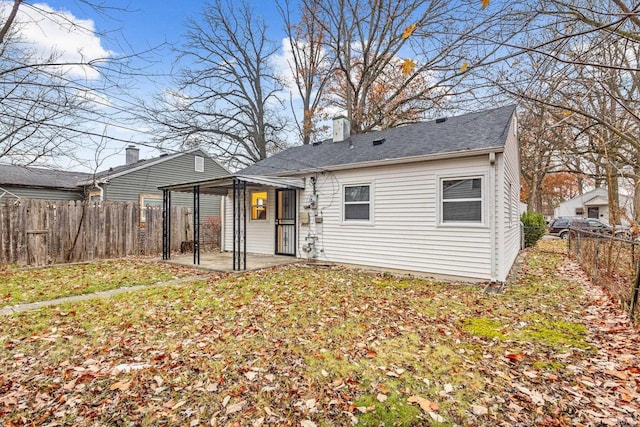 back of house with a patio