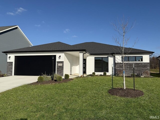 15384 Brimwillow Dr, Huntertown, IN 46748 - view of front of home with an attached garage, driveway, a front lawn, and roof with shingles