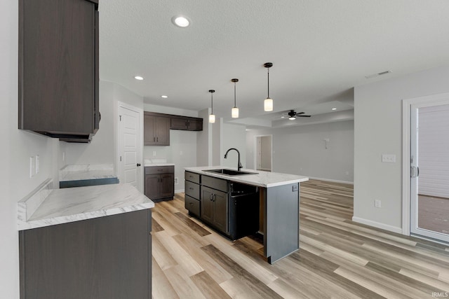 15384 Brimwillow Dr, Huntertown, IN 46748 - kitchen featuring a sink, light wood-style floors, a ceiling fan, dark brown cabinets, and black dishwasher