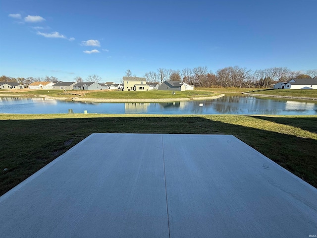 view of patio with a water view