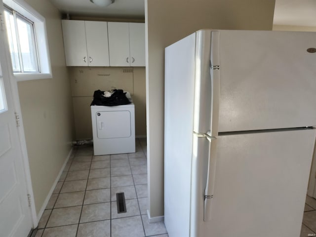 washroom featuring light tile patterned floors and washer / dryer