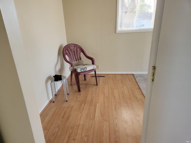 living area featuring light hardwood / wood-style floors