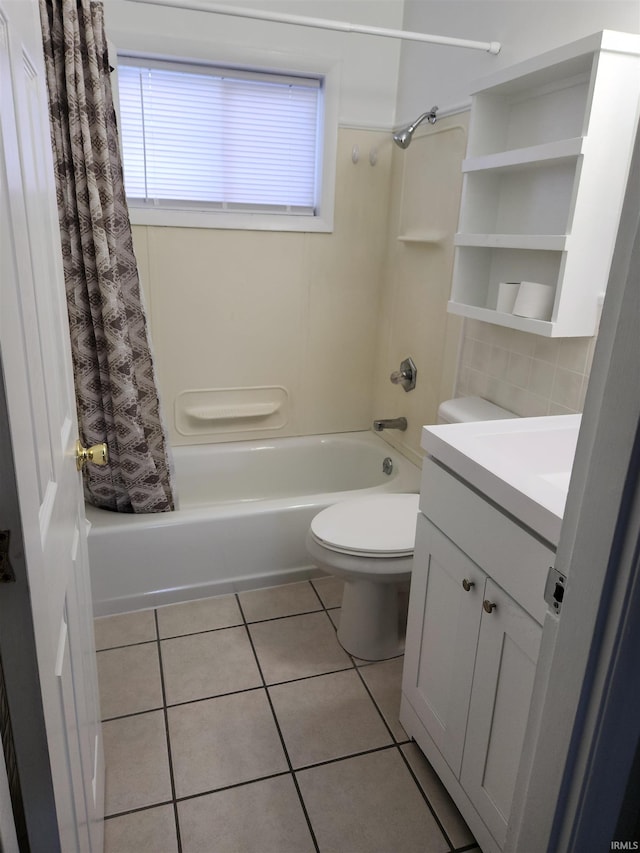 full bathroom with tile patterned floors, shower / bath combo, toilet, and vanity