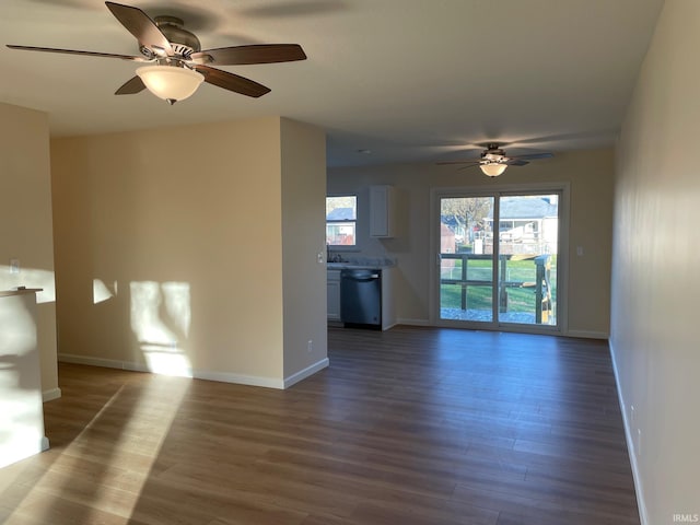 unfurnished living room with hardwood / wood-style flooring and ceiling fan