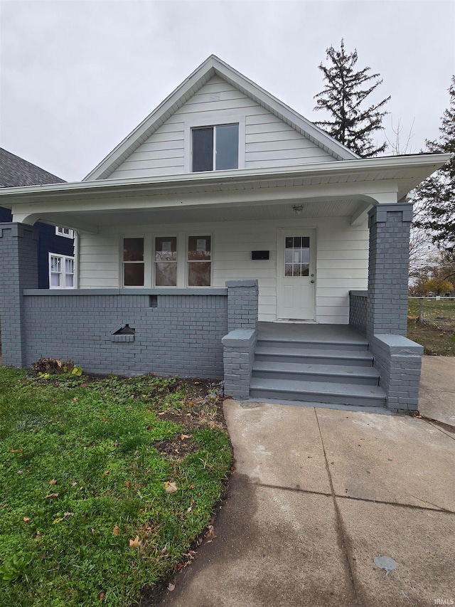 bungalow-style house featuring covered porch