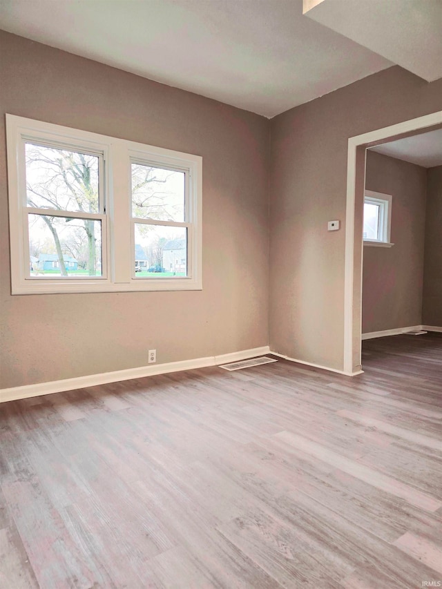 empty room featuring hardwood / wood-style floors