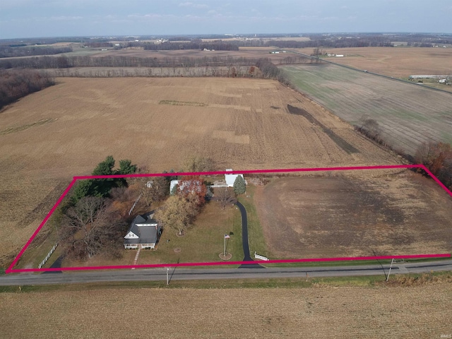 birds eye view of property featuring a rural view