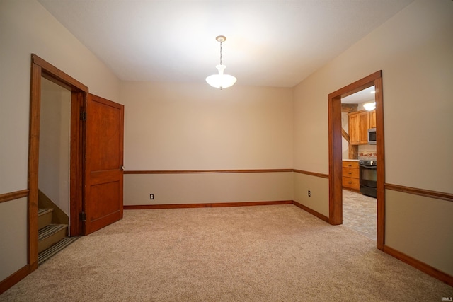 empty room with light colored carpet