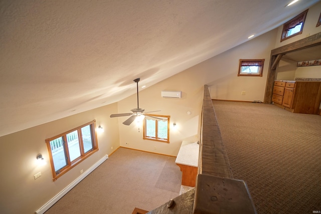 bonus room with ceiling fan, light colored carpet, a textured ceiling, and vaulted ceiling