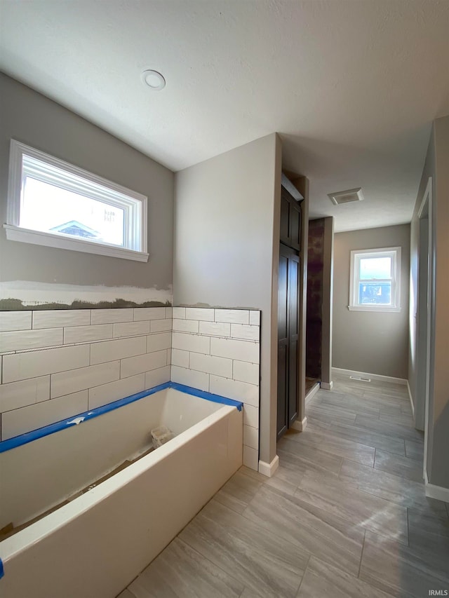 bathroom with a washtub