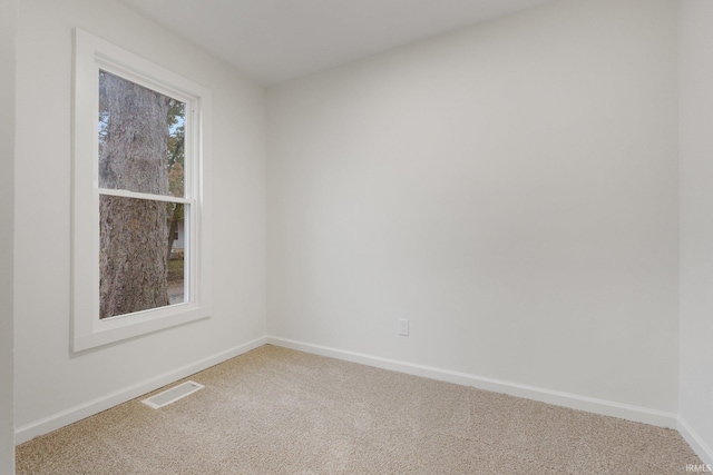 unfurnished room featuring carpet flooring