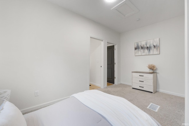 bedroom with light colored carpet