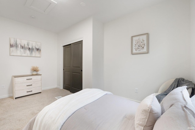 carpeted bedroom featuring a closet