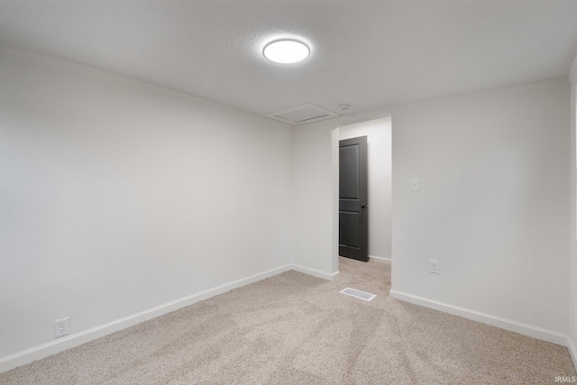 carpeted spare room with a textured ceiling