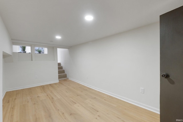 basement featuring light hardwood / wood-style flooring