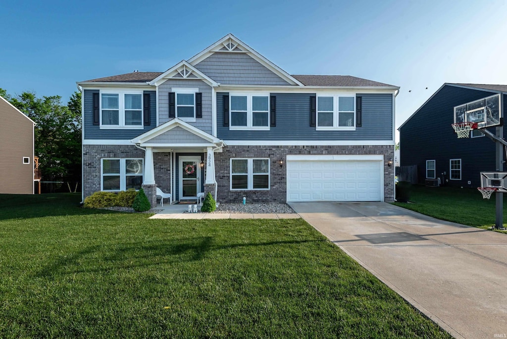 craftsman-style house with a front lawn and a garage