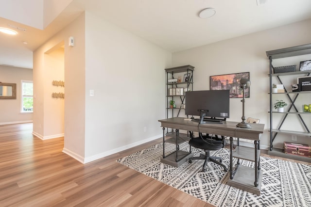 office area with hardwood / wood-style floors