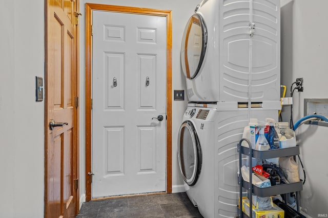 washroom featuring laundry area and stacked washer and clothes dryer