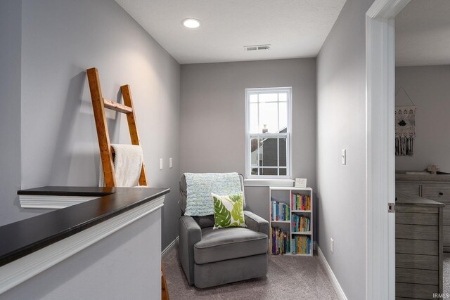 living area with carpet