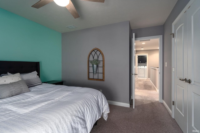 carpeted bedroom with ceiling fan, independent washer and dryer, and a closet