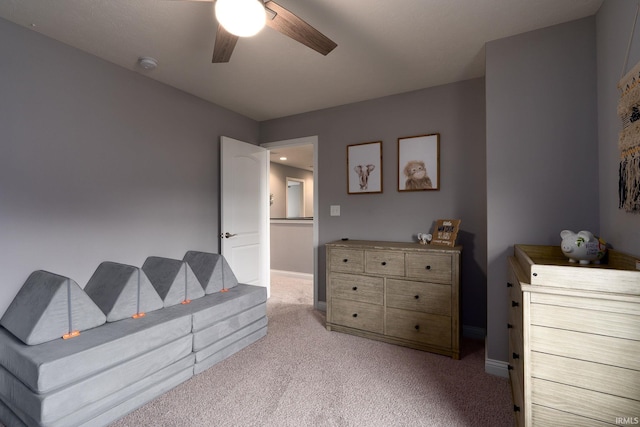 bedroom featuring ceiling fan and light colored carpet