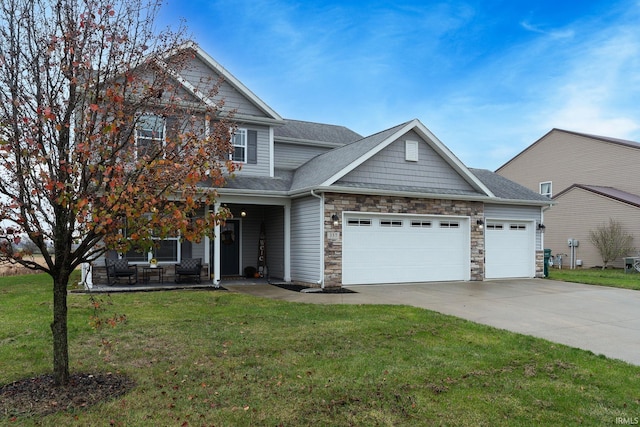 view of front of house with a garage and a front yard