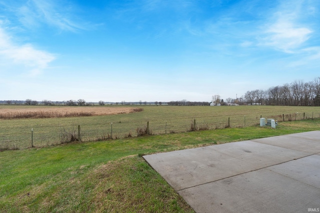 view of yard with a rural view