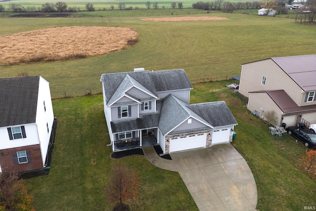 birds eye view of property featuring a rural view