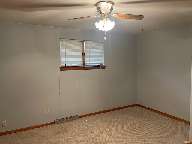 spare room with carpet flooring and ceiling fan