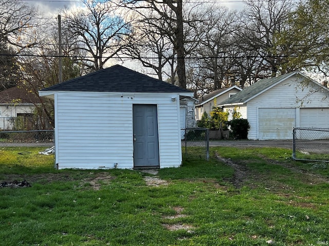 view of outdoor structure featuring a lawn