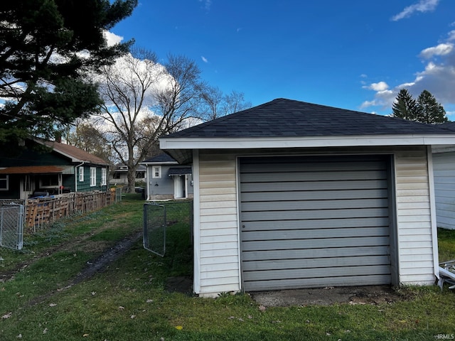 garage with a lawn