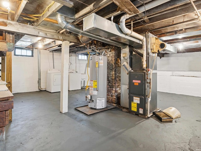 basement with separate washer and dryer, heating unit, and water heater