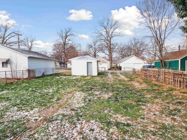 view of yard with an outdoor structure and a garage