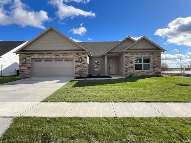 view of front of property with a garage and a front lawn