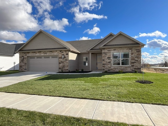 view of front of property with a garage and a front lawn