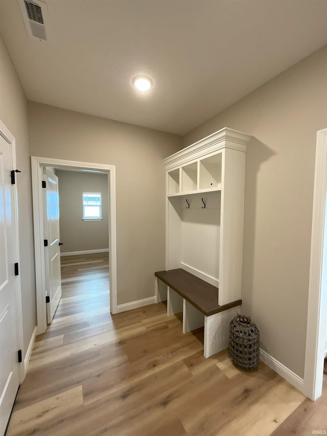 mudroom with light hardwood / wood-style flooring