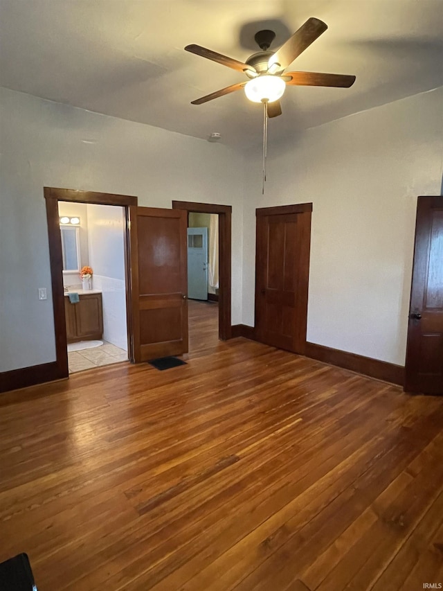 531 E 5th St, Mount Vernon, IN 47620 - unfurnished bedroom with wood finished floors, baseboards, and ceiling fan